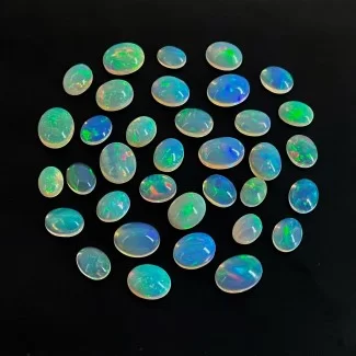 51.90 Cts. Ethiopian Opal 8X6-11X9mm Smooth Oval Shape AAA Grade Cabochons Parcel - Total 35 Pcs.