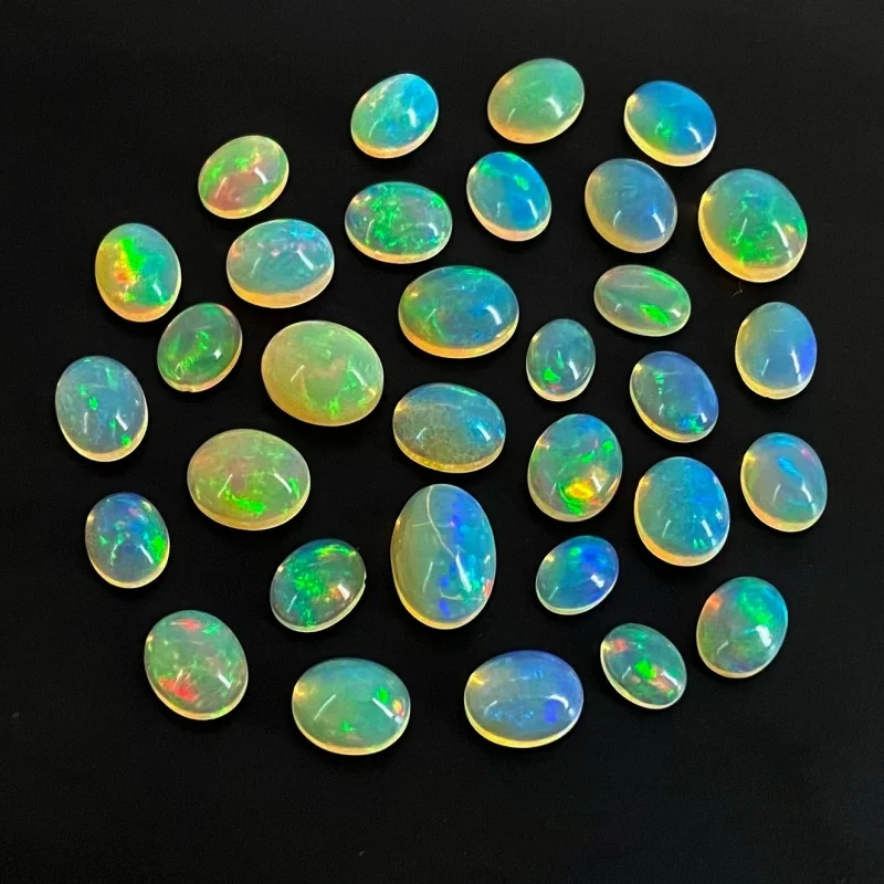 54.40 Cts. Ethiopian Opal 8x6-13x9mm Smooth Oval Shape AAA+ Grade Cabochons Parcel - Total 32 Pcs.