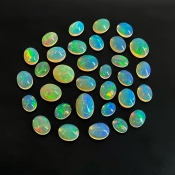 54.40 Cts. Ethiopian Opal 8x6-13x9mm Smooth Oval Shape AAA+ Grade Cabochons Parcel - Total 32 Pcs.