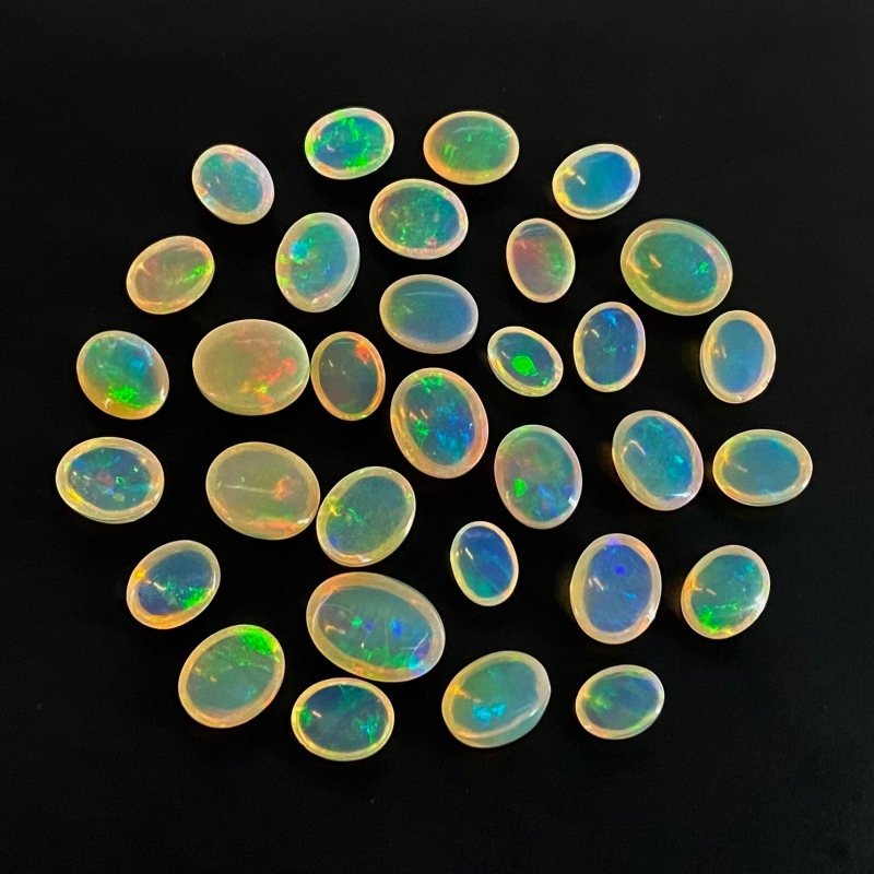 54.40 Cts. Ethiopian Opal 8x6-13x9mm Smooth Oval Shape AAA+ Grade Cabochons Parcel - Total 32 Pcs.