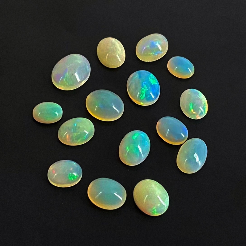 24.15 Cts. Ethiopian Opal 8x6-12x10mm Smooth Oval Shape AA Grade Cabochons Parcel - Total 15 Pcs.