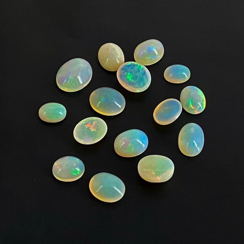 24.15 Cts. Ethiopian Opal 8x6-12x10mm Smooth Oval Shape AA Grade Cabochons Parcel - Total 15 Pcs.