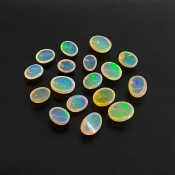 26.20 Cts. Ethiopian Opal 8X6-11X9mm Smooth Oval Shape AAA+ Grade Cabochons Parcel - Total 17 Pcs.