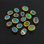 26.20 Cts. Ethiopian Opal 8X6-11X9mm Smooth Oval Shape AAA+ Grade Cabochons Parcel - Total 17 Pcs.