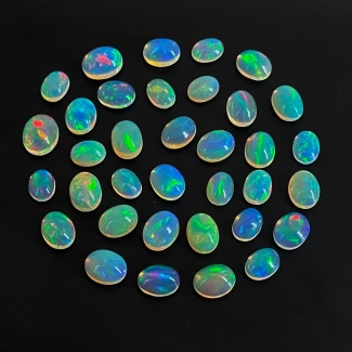 42.15 Cts. Ethiopian Opal 8x6-10x8mm Smooth Oval Shape AAA Grade Cabochons Parcel - Total 35 Pcs.