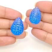 49.78 Cts. Swiss Blue Topaz 23x16mm Carved Pear Shape AAA+ Grade Matched Gemstone Carvings Pair - Total 2 Pcs.