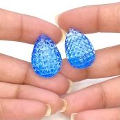 49.78 Cts. Swiss Blue Topaz 23x16mm Carved Pear Shape AAA+ Grade Matched Gemstone Carvings Pair - Total 2 Pcs.