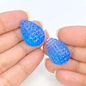 49.78 Cts. Swiss Blue Topaz 23x16mm Carved Pear Shape AAA+ Grade Matched Gemstone Carvings Pair - Total 2 Pcs.
