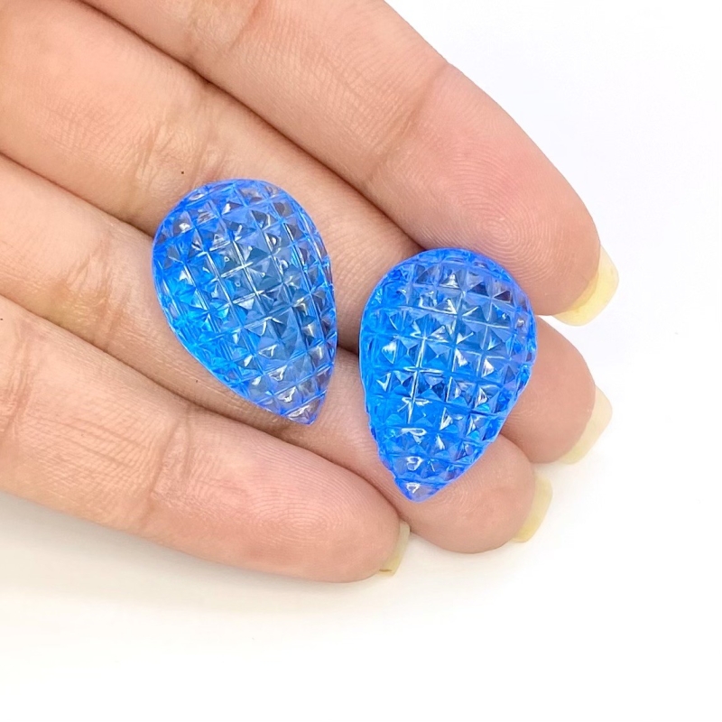49.78 Cts. Swiss Blue Topaz 23x16mm Carved Pear Shape AAA+ Grade Matched Gemstone Carvings Pair - Total 2 Pcs.