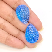 49.78 Cts. Swiss Blue Topaz 23x16mm Carved Pear Shape AAA+ Grade Matched Gemstone Carvings Pair - Total 2 Pcs.