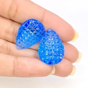 49.78 Cts. Swiss Blue Topaz 23x16mm Carved Pear Shape AAA+ Grade Matched Gemstone Carvings Pair - Total 2 Pcs.