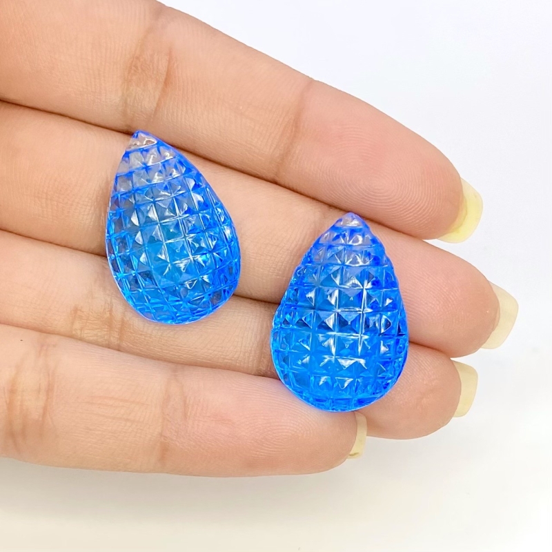 49.78 Cts. Swiss Blue Topaz 23x16mm Carved Pear Shape AAA+ Grade Matched Gemstone Carvings Pair - Total 2 Pcs.