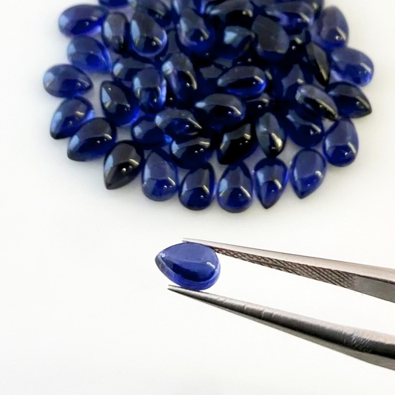 27.05 Carat Iolite 6x4mm Smooth Pear Shape A Grade Cabochons Parcel - Total 60 Pcs.