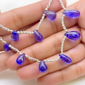 Tanzanite 9.5-15mm Smooth Drop Shape AA+ Grade Gemstone Beads Layout - Total 1 Strand of 9 Inch.
