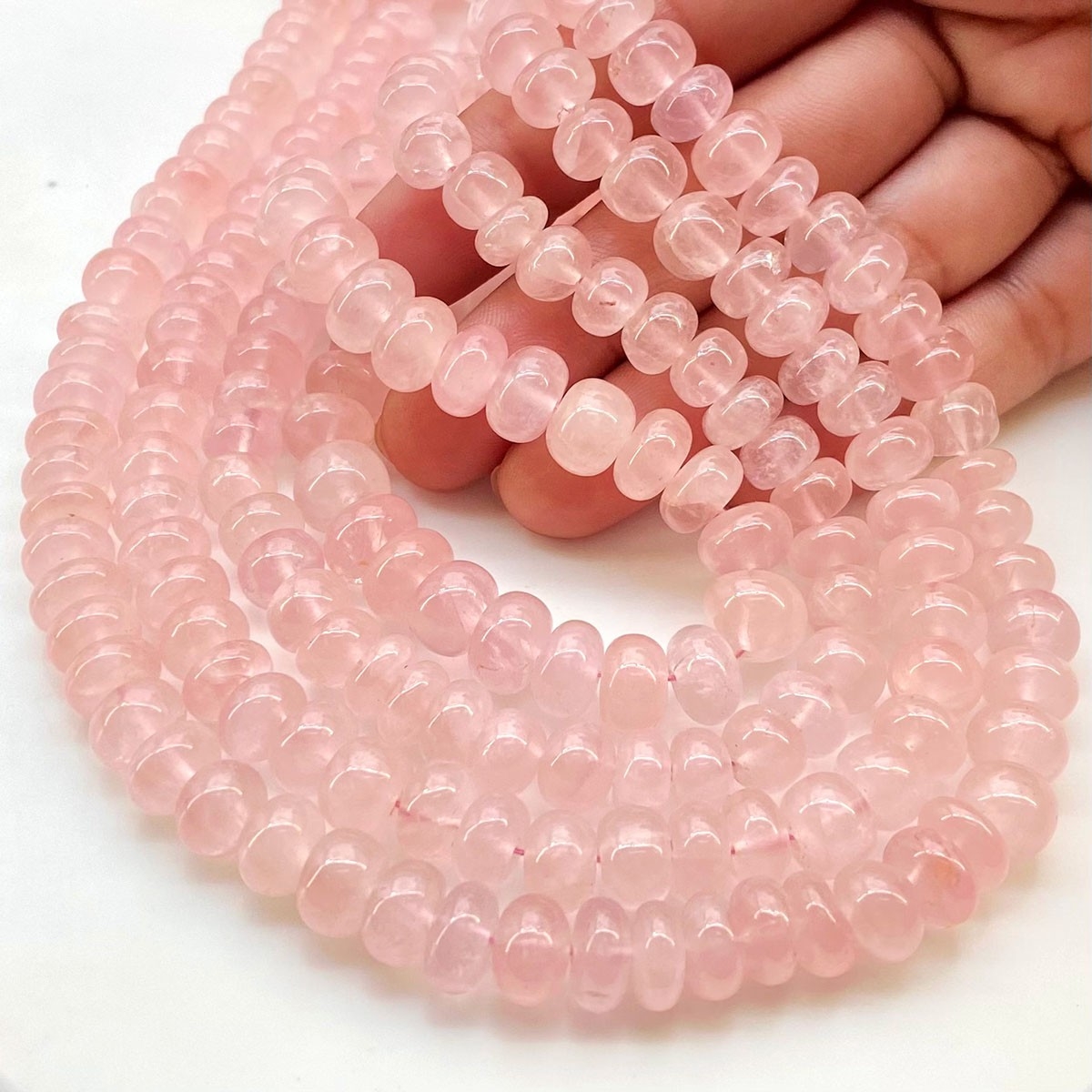 Bead, rose quartz (natural), 10mm rose-cut round, B grade, Mohs hardness 7.  Sold per 8-inch strand, approximately 20 beads. - Fire Mountain Gems and  Beads