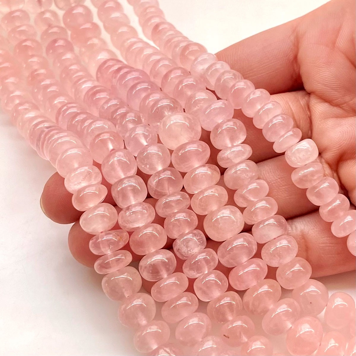 Bead, rose quartz (natural), 10mm rose-cut round, B grade, Mohs hardness 7.  Sold per 8-inch strand, approximately 20 beads. - Fire Mountain Gems and  Beads