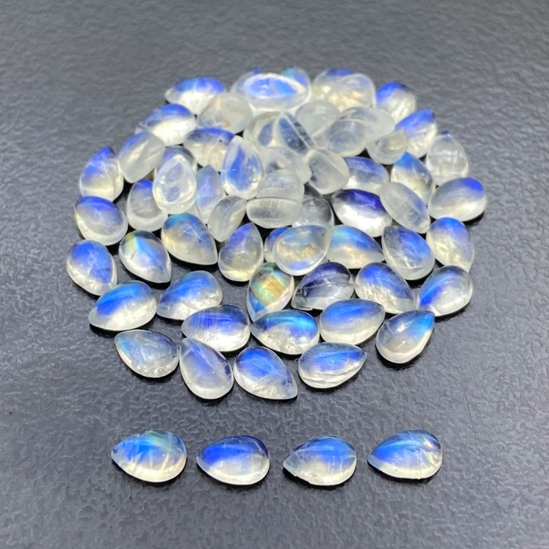 28.2 Cts. Rainbow Moonstone 6x4mm Smooth Pear Shape AA+ Grade Cabochons Parcel - Total 64 Pc.