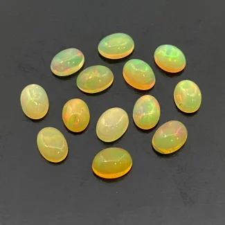 7.66 Cts. Ethiopian Opal 7x5mm Smooth Oval Shape AA Grade Cabochons Parcel - Total 13 Pc.