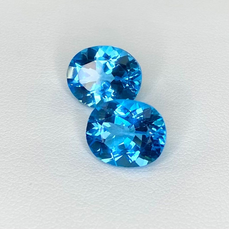  11.66 Cts. Swiss Blue Topaz 12x10mm Faceted Oval Shape AAA Grade Matched Gemstones Pair - Total 2 Pcs.